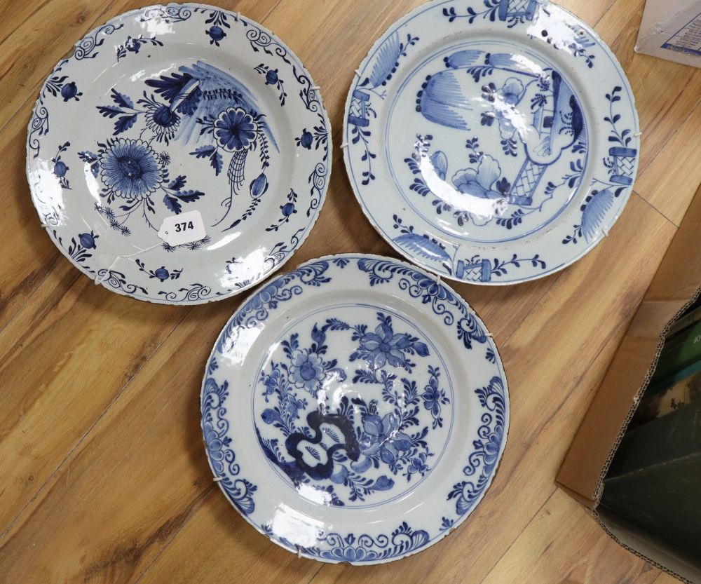 Three 18th century Delft dishes, largest diameter 36cm